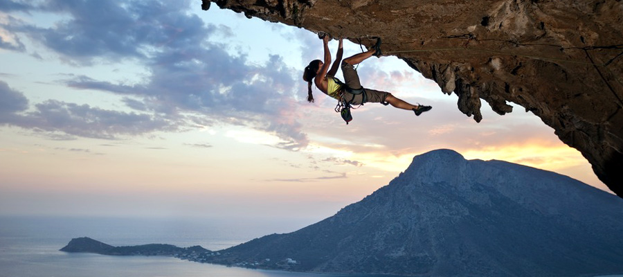 Young female rock climber at sunset, Kalymnos Island, Greece